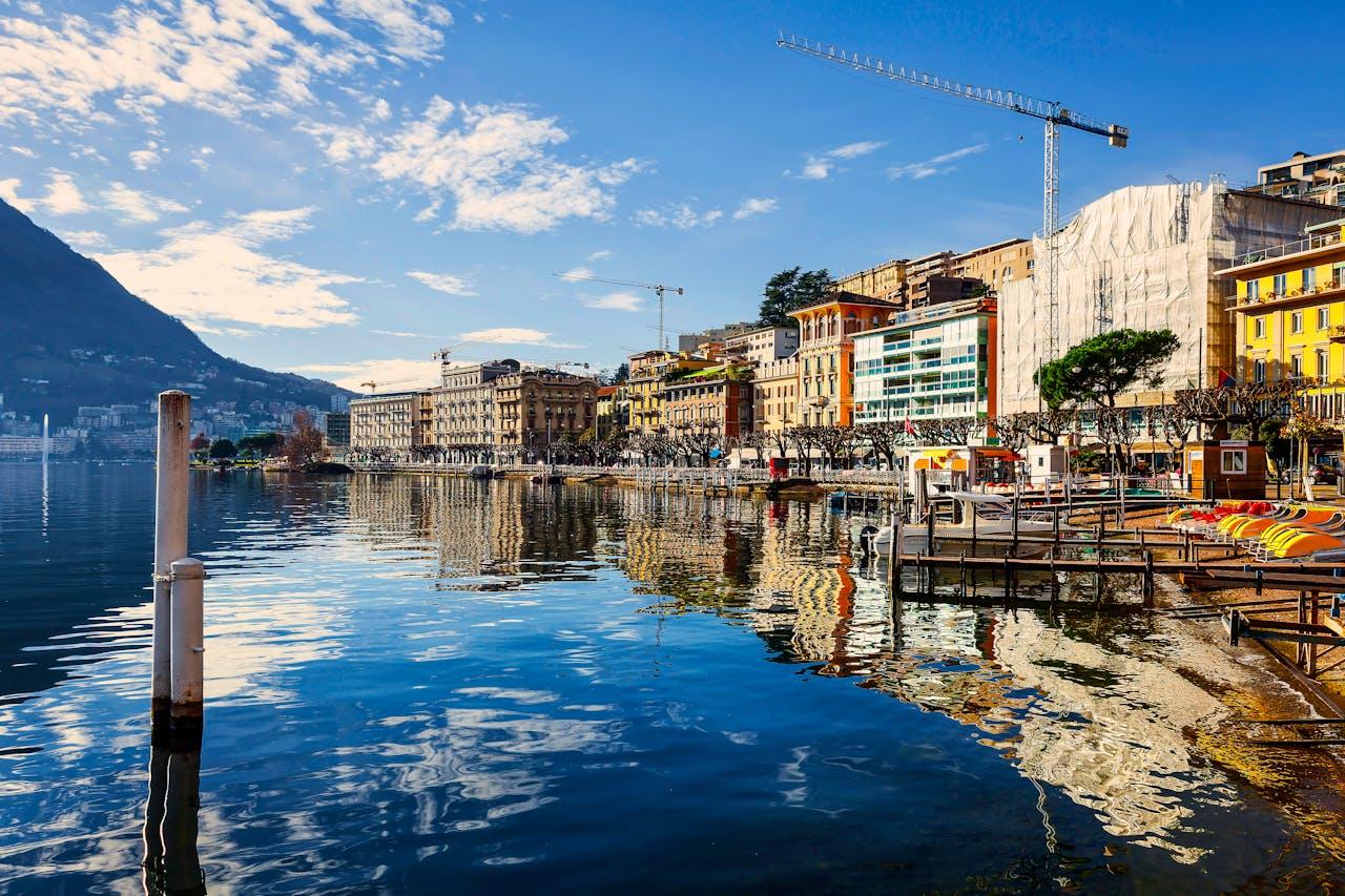 Lake Lugano with old town and promenade.
